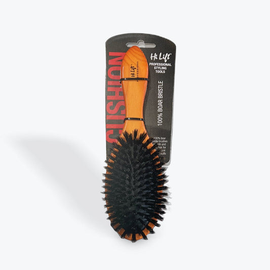 Hairbrush with black bristles and orange handle on a white background