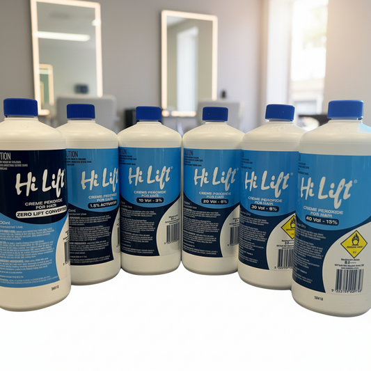 Multiple bottles of Hi Lift peroxides and developers products on a white salon background