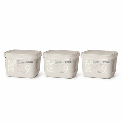 Three rectangular plastic containers of BLOOM ME 9+ Premium Lightener in a light beige color, arranged side-by-side on a white background.
