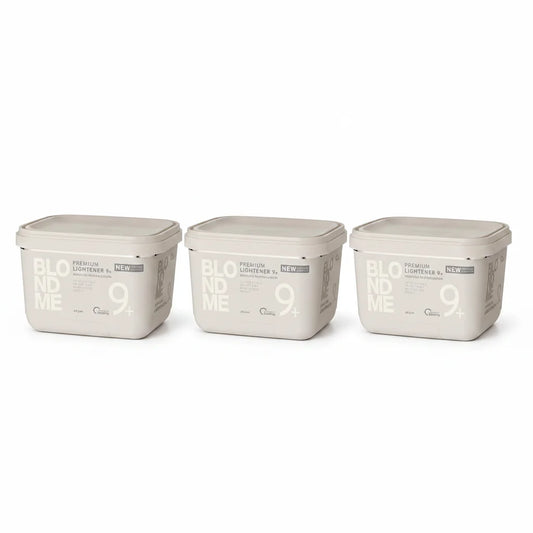 Three rectangular plastic containers of BLOOM ME 9+ Premium Lightener in a light beige color, arranged side-by-side on a white background.