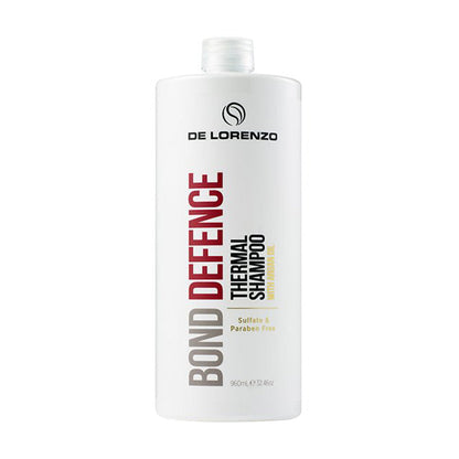A 960ml bottle of De Lorenzo Bond Defence Thermal Shampoo with a pump dispenser, predominantly white in color with red and grey text and accents.