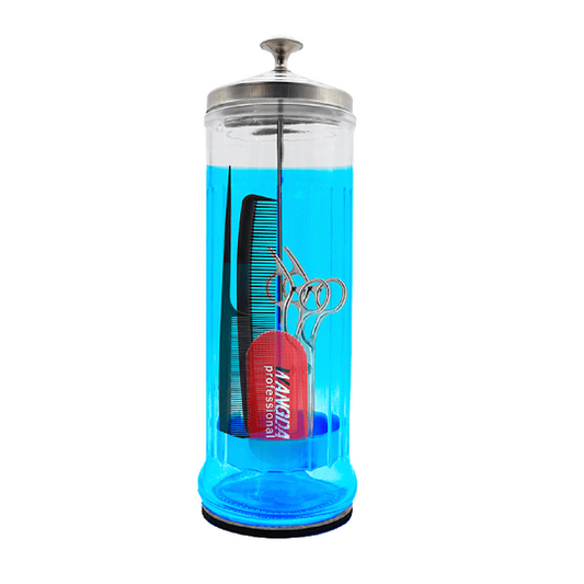 Glass hair salon disinfecting container with hairdressing tools inside on a white background