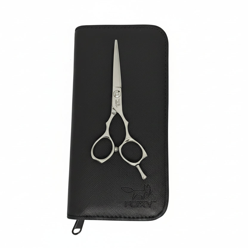 Black wallet with silver scissors on a white background