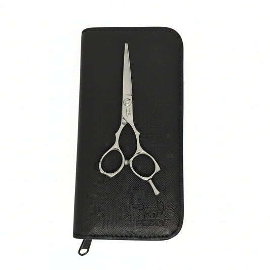 Black wallet with silver scissors on a white background