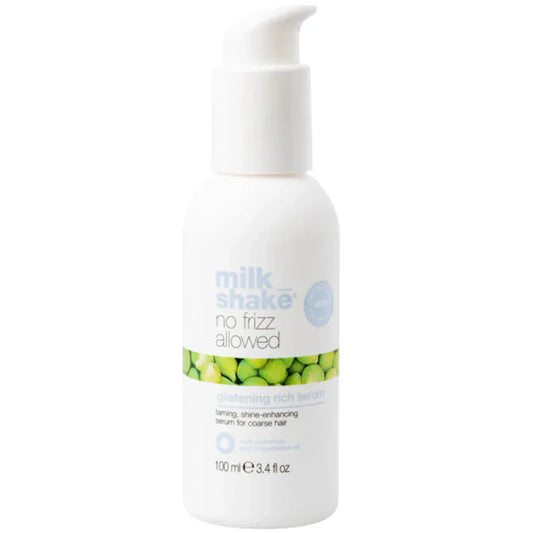 White bottle of 'milk shake no frizz glistening rich serum' product with green label on a white background