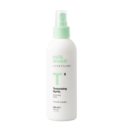 Milkshake White texturizing spritz spray bottle with green nozzle labeled 'milk_shake' on a white background