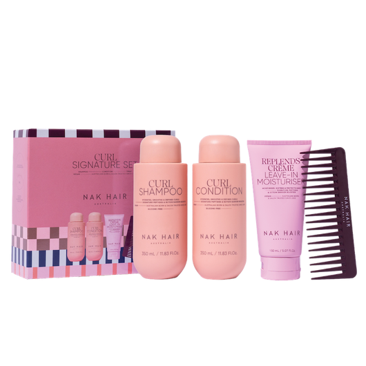 Nak Hair Curl Care Set with shampoo, conditioner, moisturizer, and comb on a white background