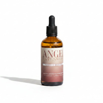 Brown bottle with dropper labeled 'Angel Extensions' on a light surface.