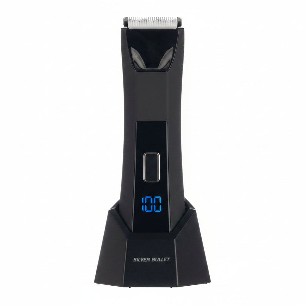 A black electric hair trimmer with a digital display showing '100' in blue, labeled 'SILVER BULLET' on the base, shown against a split white and dark textured background.