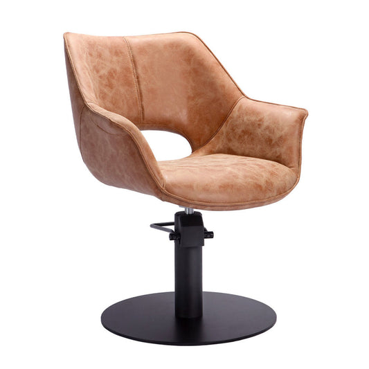 Brown upholstered salon chair with a black base on a white background