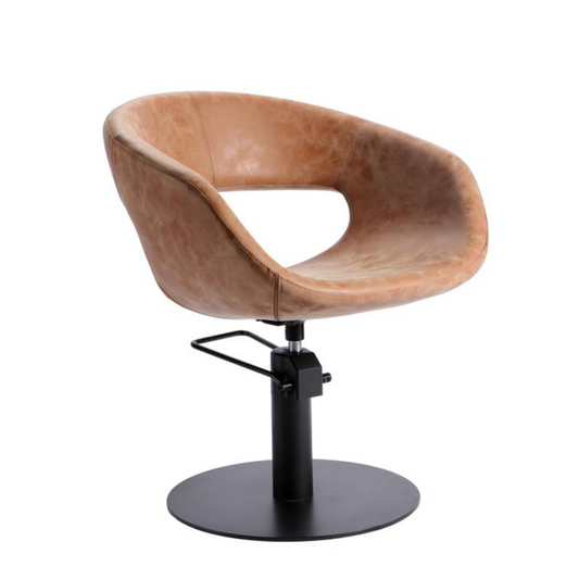 Brown leather salon chair with black metal base on a white background