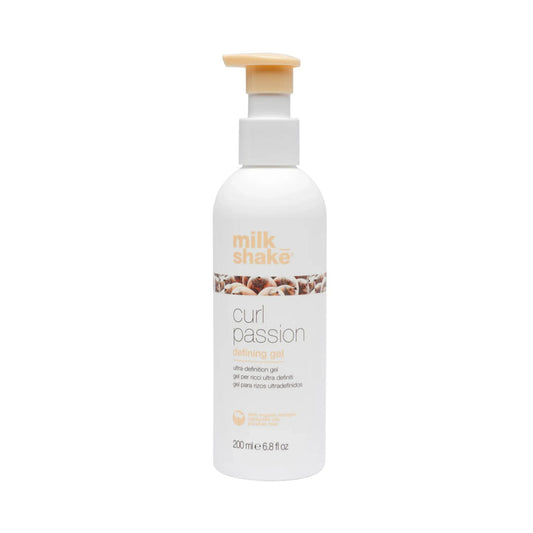 Bottle of Milk Shake Curl Passion defiing gel product on a white background
