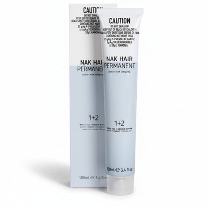 Nak Hair Permanent hair color 1+2 developer and color cream set in white tubes with black text, shown against a plain white background.
