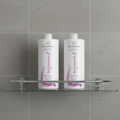 Two bottles of De Lorenzo Rejuven8 shampoo and conditioner on a shower shelf 