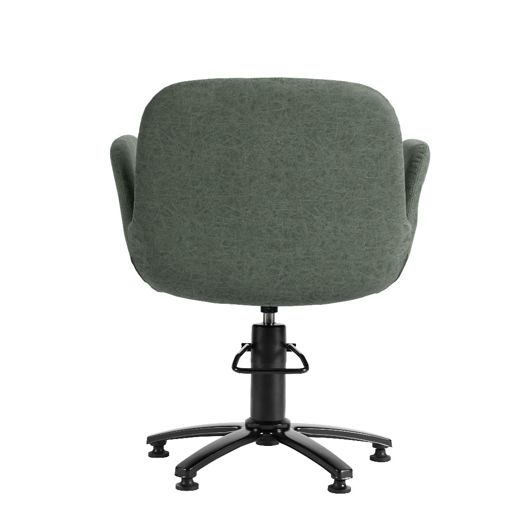 A modern upholstered salon chair with a rounded, high-back seat in textured sage green fabric, featuring integrated armrests, a black gas-lift swivel base, and five black caster wheels, shown against a plain white background.
